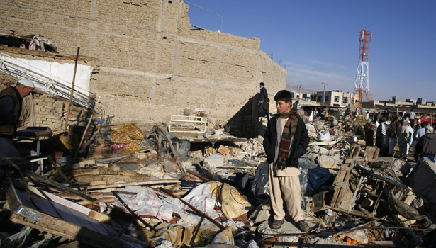 A boy stands at the site of Saturday's bomb attack in a Shi'ite Muslim area in Quetta