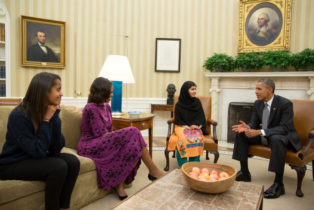 President Barack Obama, First Lady Michelle Obama, and their daughter Malia meet with Malala Yousafzai, the young Pakistani schoolgirl who was shot in the head by the Taliban a year ago, in the Oval Office, Oct. 11, 2013.  (Official White House Photo by Pete Souza)