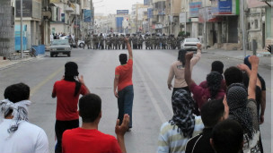 130217100136_anti-riot_police_face_off_with_protesters_in_saudi_arabias_eastern_gulf_coast_town_of_qatif__304x171_reuters_nocredit