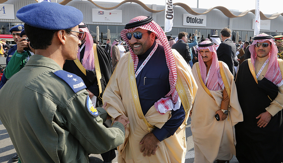 Saudi Arabia's Prince Turki bin Abdullah al Saud, deputy governor of Riyadh, meets Saudi Royal Force pilots during the inauguration of the Bahrain International Airshow held at the Sakhir Air Base