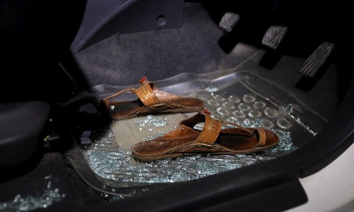 Broken glass in the car where Sabeen was murdered - Reuters