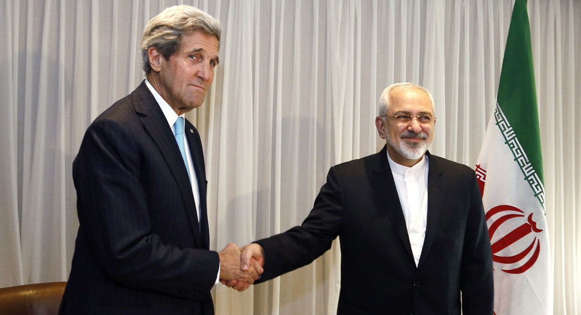 Iranian Foreign Minister Mohammad Javad Zarif shakes hands on January 14, 2015 with US State Secretary John Kerry in Geneva. Zarif said on January 14 that his meeting with his US counterpart was vital for progress on talks on Tehran's contested nuclear drive. Under an interim deal agreed in November 2013, Iran's stock of fissile material has been diluted from 20 percent enriched uranium to five percent, in exchange for limited sanctions relief.   AFP PHOTO / POOL / RICK WILKING        (Photo credit should read RICK WILKING/AFP/Getty Images)