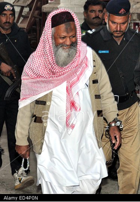 Malik Ishaq escorted to court by the police