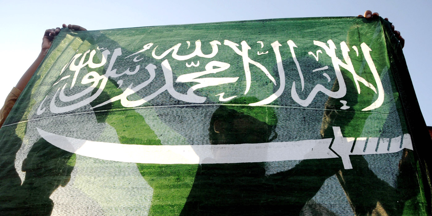 Image #: 35890612 epa04687793 Supporters of banned Islamic charity Jamatud Dawa hold a Saudi flag as they shout slogans during a rally to support Saudi-led military operation in Yemen, in Karachi, Pakistan, 31 March 2015. A Pakistani delegation left for Saudi Arabia 31 March, to discuss the crisis in Yemen and Saudi request for deployment of Pakistani troops. Pakistani Defence Minister Khawaja Asif led the delegation which included foreign affairs advisor Sartaj Aziz and other officials. The Saudi government approached Pakistan last week to provide troops in support of its operation in Yemen. EPA/SHAHZAIB AKBER /LANDOV