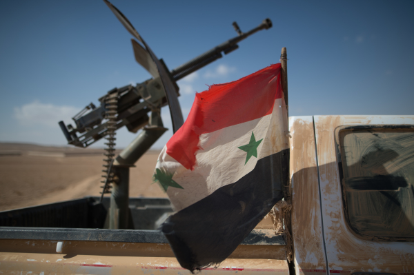2795226 02/20/2016 A Syrian flag on a truck with a machine gun of the Syrian Arab Army (SAA) near the town of Mhin, Syria. Iliya Pitalev/Sputnik