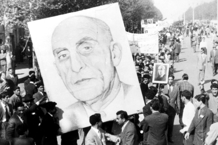 Shiraz, Iran: Vast portraits of Premier Mossadeq are carried by demonstrators in Shiraz, about 450 miles south of Teheran, in support of the Premier's demand for the passage by the Majlis of the eight-man report limiting the powers of the Shah. 20 April 1953 Great Britain / Mono Negative